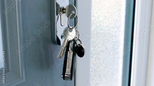 Swinging keys on a modern door. Car keys. photo