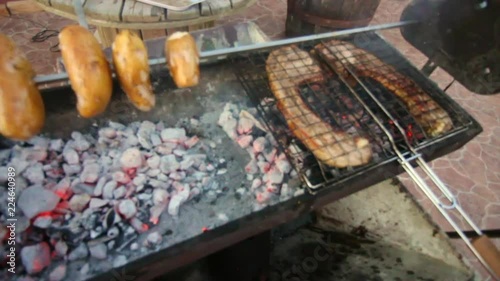 Cooking Baked Potatoes and Giant Pork Chops on the BBQ photo