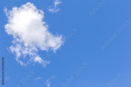 Blue sky background with white clouds, rain clouds.