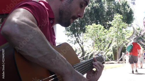 Guitarrist Musician busking in the park
