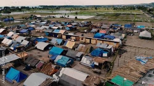 A cinematic aerial shot of a relief camp in north Lombok where hundreds of earthquake survivors are now living photo
