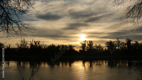 clouds and sunset on the river © dstrandt