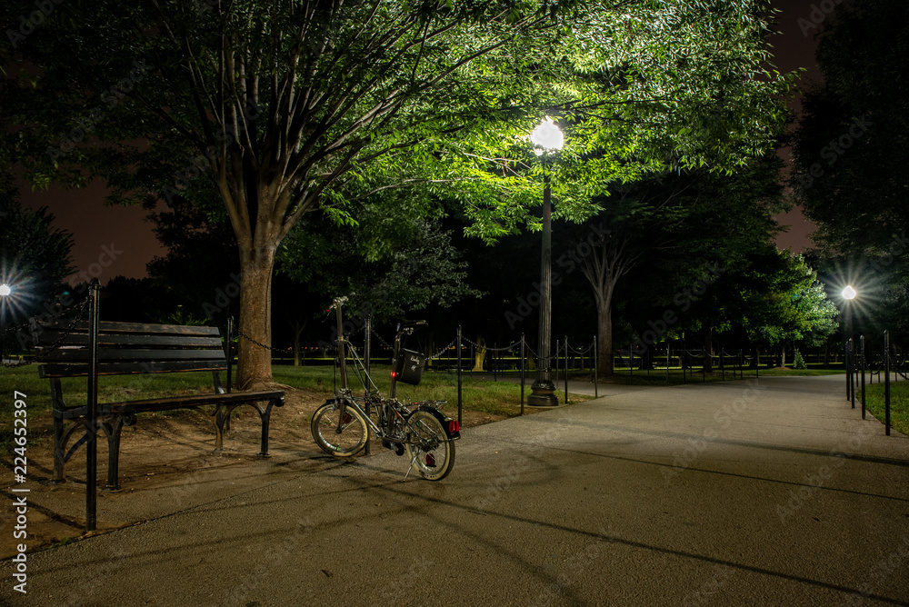 Fototapeta premium Bicycle in public park at night.