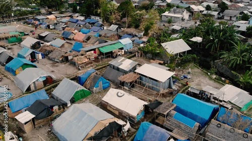 A cinematic drone shot of a relief camp in north Lombok where hundreds of earthquake survivors are now living. photo