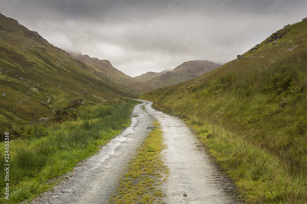 A dirt road through the mountains 