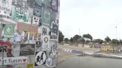 A shot of the NDSM wharf, Noorderlicht in the distance, a typical urban wall full of stickers in Amsterdam. photo