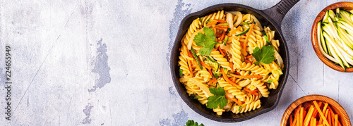 Fusilli pasta with squid, zucchini and carrots