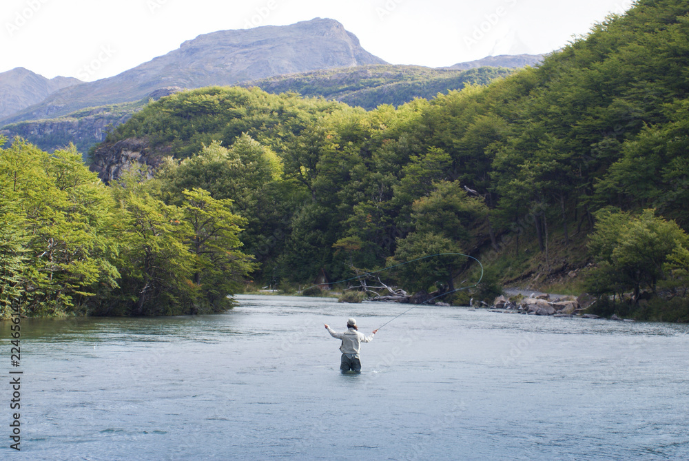 Fly fisherman casting in Cañadon de los Toros River, near Lago del Desierto, Patagonia Argentina Fly fisherman casting in Cañadon de los Toros River, near Lago del Desierto, Patagonia Argentina