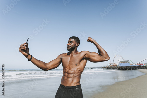 Fit man taking a selfie by Santa Monica Pier