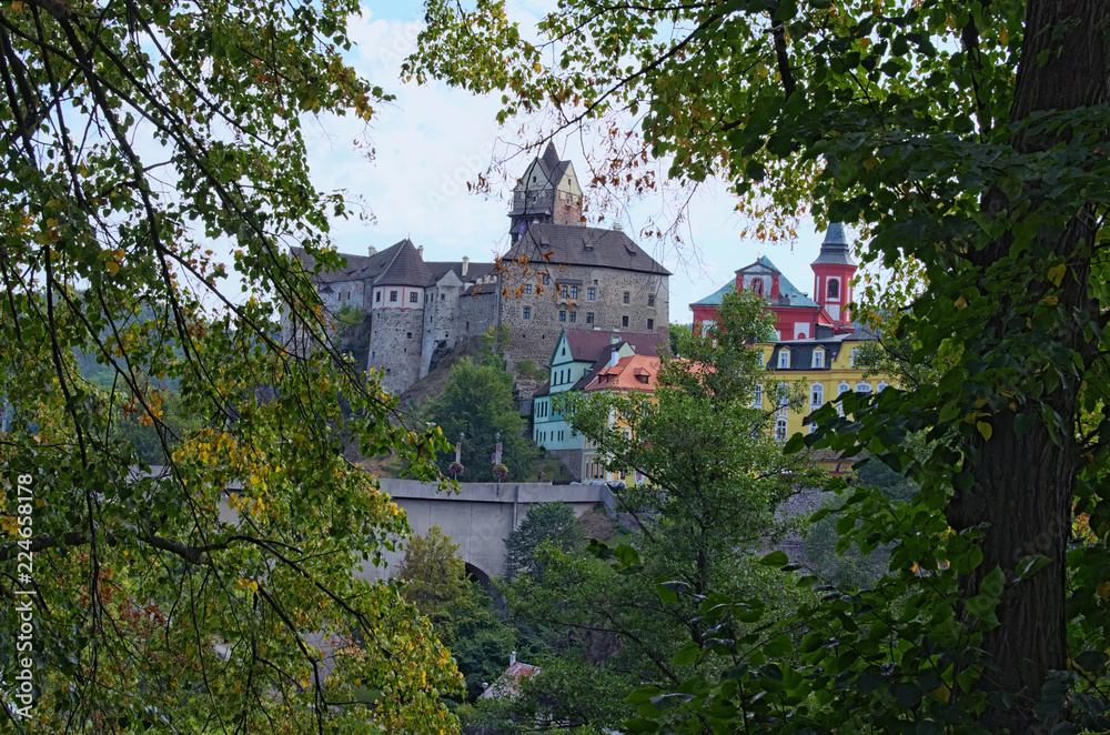 Fototapeta premium Beautiful view of Loket Castle with colorful buildings by summer sunny day. Bohemia, Sokolov, Karlovarsky Region, Czech Republic