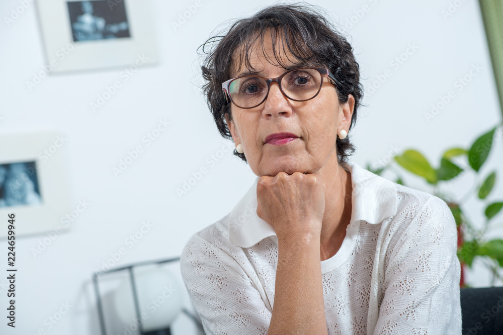 portrait of a beautiful mature woman with eyeglasses at home portrait of a beautiful mature woman with eyeglasses at home
