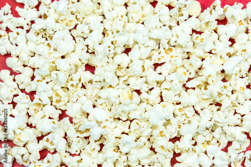 A pile popcorn on red background A pile popcorn on red background