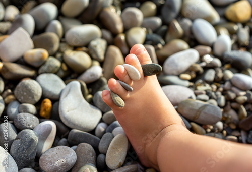 Leg of little child at sea beach