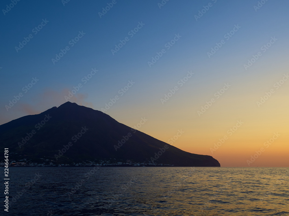 Shooting the volcano at sunset from the boat