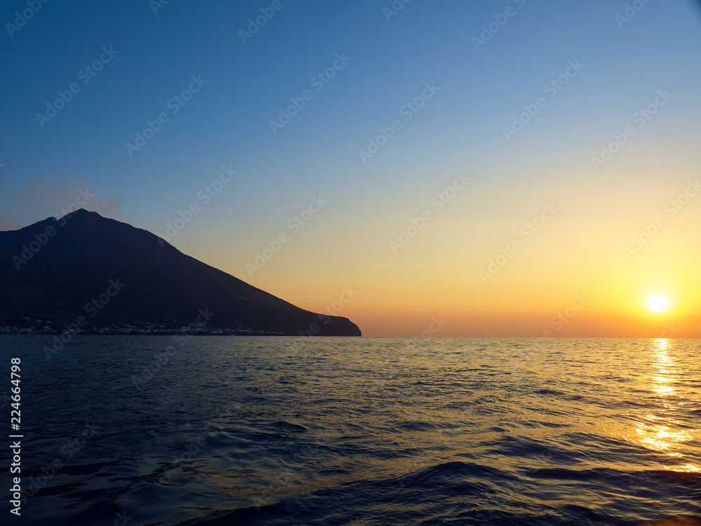 Shooting the volcano at sunset from the boat