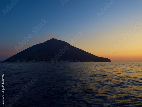 Shooting the volcano at sunset from the boat