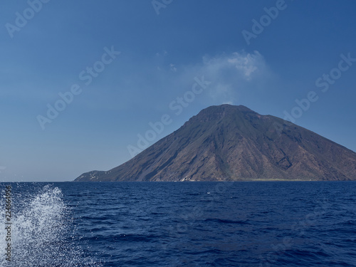 View of Stromboli island and volcano from the boat in a summer afternoon
