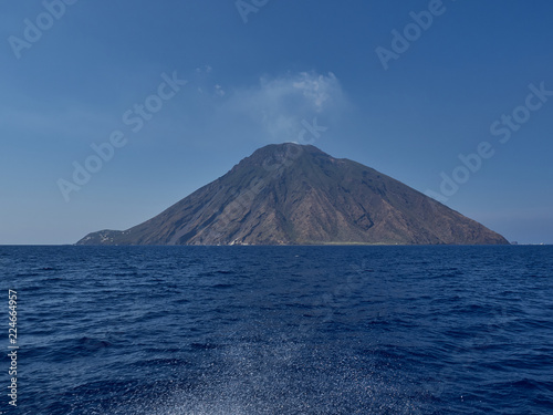 View of Stromboli island and volcano from the boat in a summer afternoon