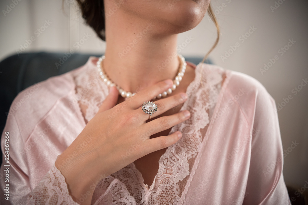 ring on girls hand and necklace on neck 