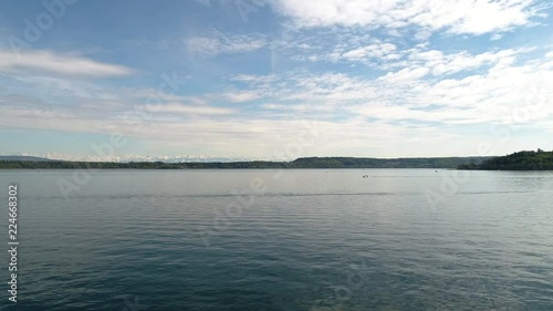 aerial view on blue lake with some boats snow mountains in distance, lake biel switzerland photo