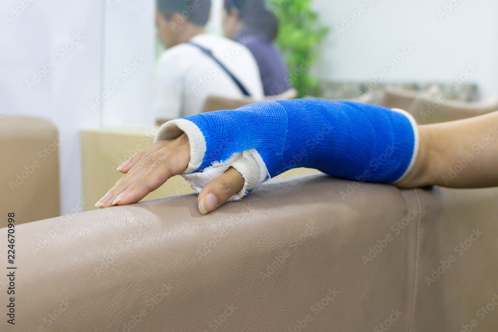 Arm of woman who have got wounded and wearing a splint