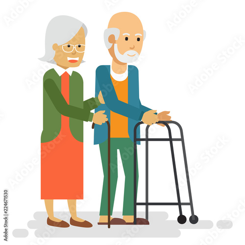 Happy old couple smiling and walking in a park