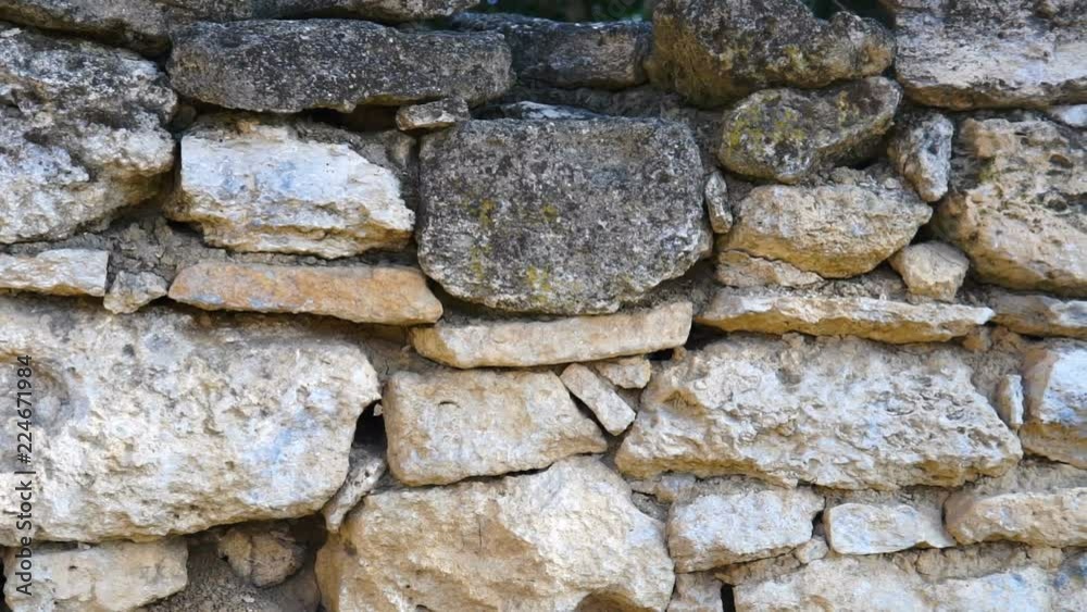 Texture of a stone wall. Old castle stone wall texture background. Stone wall as a background or texture. Camera moving. Texture of a stone wall. Old castle stone wall texture background. Stone wall as a background or texture. Camera moving.