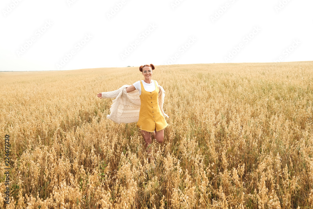 girl with red hair in the autumn field of wheat girl with red hair in the autumn field of wheat