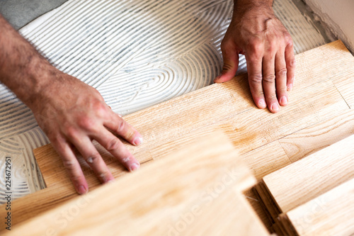 Assembling of parquet floor in progress