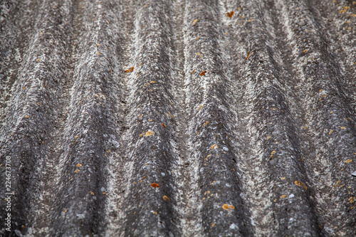 Dangerous asbestos in the city. Old building materials used for roofing and wall covering photo