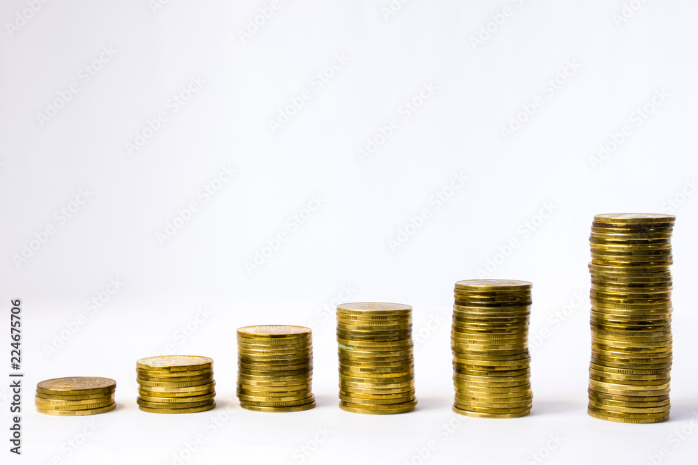 Six stacks of coin in ascending order on white gray background. Photo illustration of success in business and commerce, growth of revenue, investment, wage, rising prices for goods, services Six stacks of coin in ascending order on white gray background. Photo illustration of success in business and commerce, growth of revenue, investment, wage, rising prices for goods, services