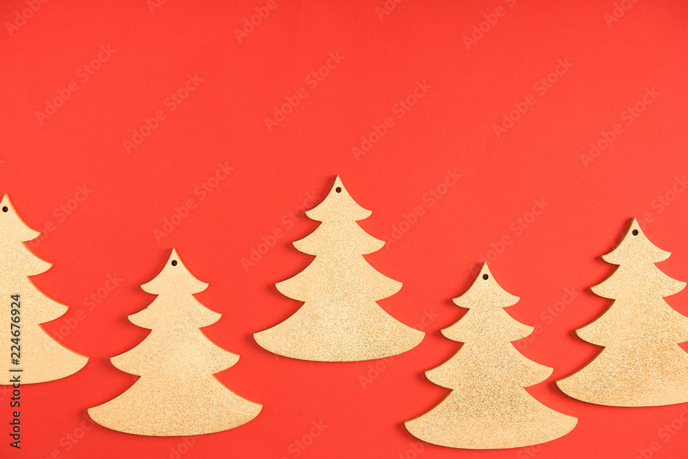close-up view of decorative fir trees on red background
