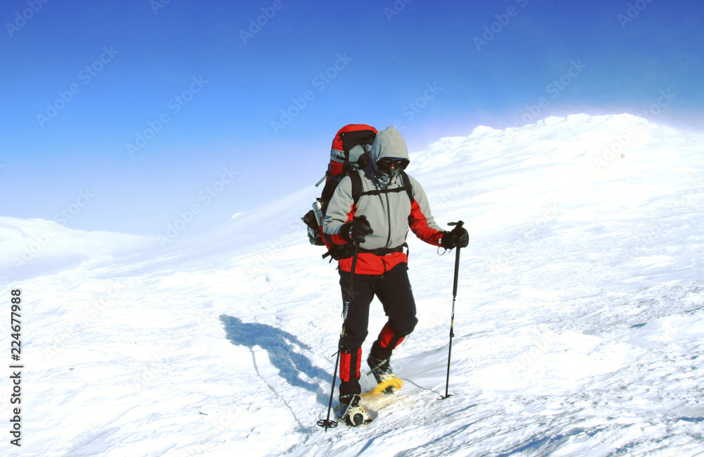 Winter hike in the mountains with a backpack and tent. Winter hike in the mountains with a backpack and tent.