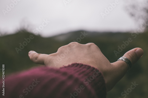 Vintage tumblr hand in a mountain background landscape autumn photo