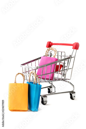 online shopping / e-commerce sale and delivery service concept, discounts, black Friday, sale: shopping cart multicolored packages and boxes with trolleybus logo on white background,