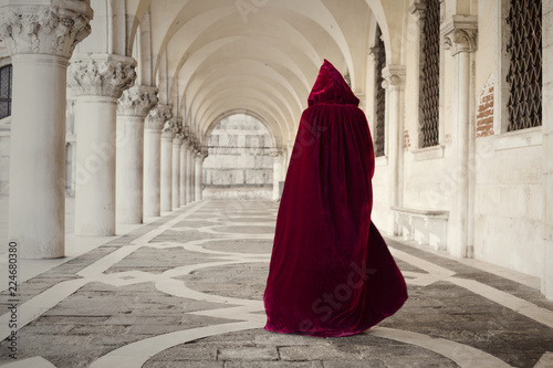 Mysterious person walking in old palace