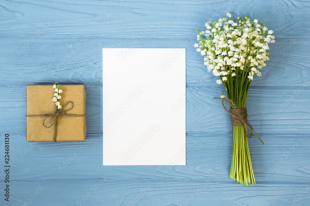 Mother's day. Women's day. Valentine's day, Birthday background. Lily of the Valley, envelope, packing gifts. Spring flat lay, top view Mother's day. Women's day. Valentine's day, Birthday background. Lily of the Valley, envelope, packing gifts. Spring flat lay, top view