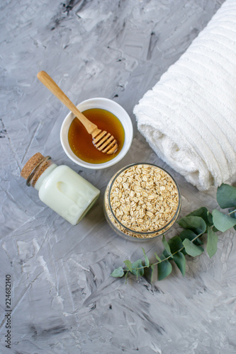 Natural Ingredients Homemade Body Oatmeal Sea Salt Scrub with Olive Oil Honey Milk White Towel Beauty Concept Skincare Organic Aroma Spa Therapy