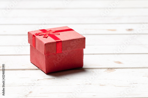Gift box on wooden board. 