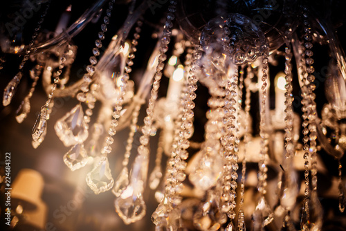 abstract image background of blur bokeh and crystal chandelier light equipment filter tone color effect
