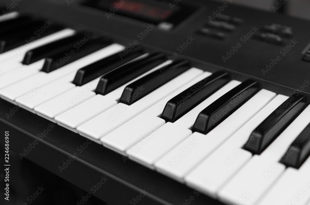 Synthesizer piano key board top view.Professional electronic midi keyboard with black and white keys. Synthesizer piano key board top view.Professional electronic midi keyboard with black and white keys.