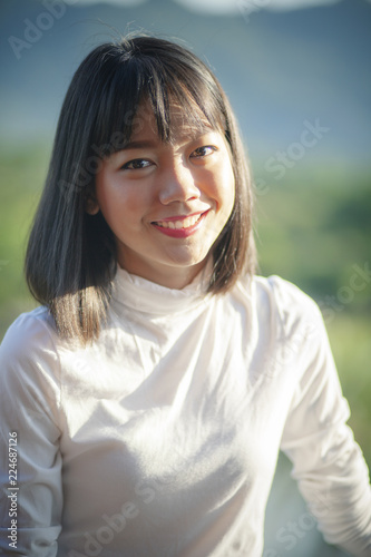 toothy smiling face of beautiful asian younger woman