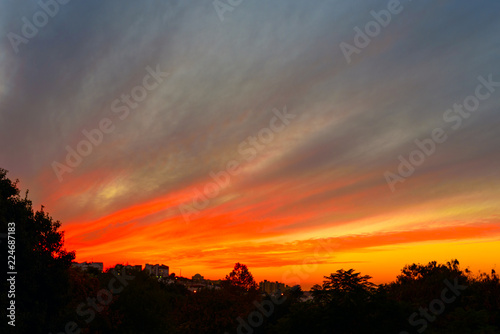Blurred city background - sunset colors. Winter sunset in Israel.