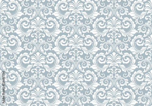 Wallpaper in the style of Baroque. Seamless vector background. White and blue floral ornament. Graphic pattern for fabric, wallpaper, packaging. Ornate Damask flower ornament
