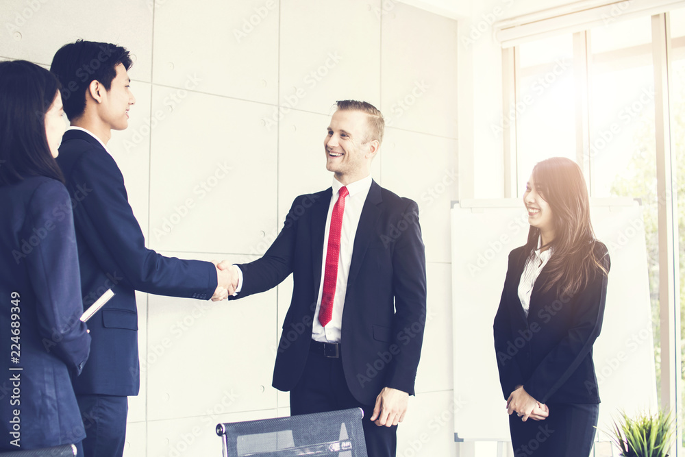 Successful negotiating business concept, Close up hand of businessmen shaking hands after finishing meeting or setting  goals and planning way to success