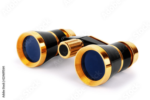 Elegant vintage small theater binocular, decorated with ivory imitation and golden details, isolated on white background