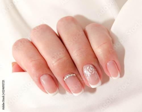  Woman s nails with beautiful french manicure fashion design