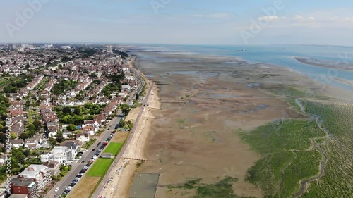 Fly over the paddling pool and the sand and mud flats full of sea weed of Chalkwell Beach when the tide is out. photo