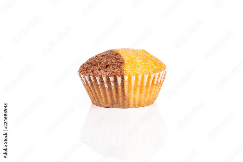 One whole tasty fresh baked marble muffin isolated on white background One whole tasty fresh baked marble muffin isolated on white background