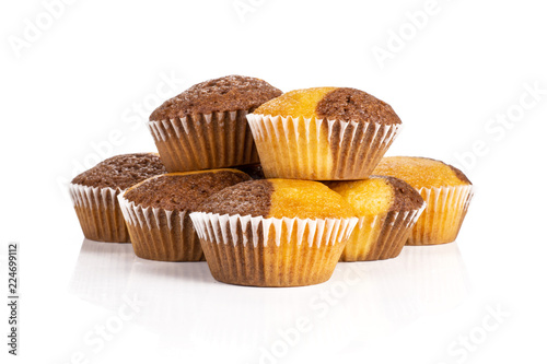 Group of seven whole fresh baked marble muffin isolated on white background